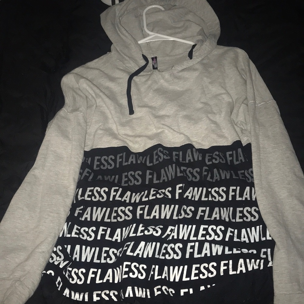 woman’s grey and black sweater